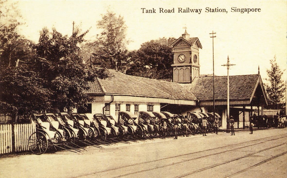 Jinrickshaws lined up to pick up fare outside Tank Road Station. Postcard from the collection of Lim Kheng Chye.
